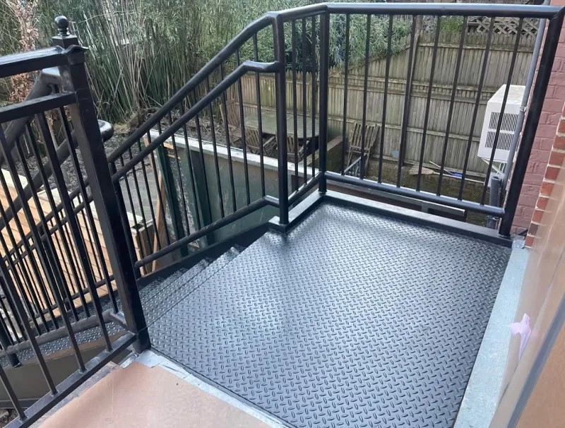 Steel cellar door installation in Brooklyn, NY — custom sidewalk cellar doors fabricated for NYC buildings